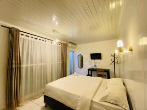 Postel nebo postele na pokoji v ubytování Sahasi Stay