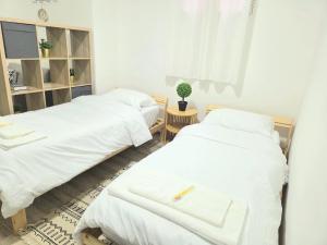 Ένα ή περισσότερα κρεβάτια σε δωμάτιο στο Olive Guest House +2 φωτογραφίες