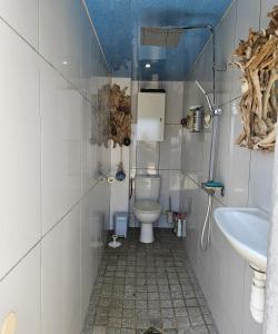 a bathroom with a toilet and a sink at Paradiso Apartment 4 people in Furiani