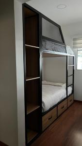 a bedroom with a bunk bed with a bunk bed at Hotel Laverdieri in Suba +15 photos