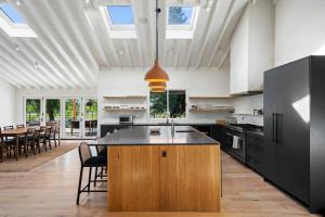 a large kitchen with a island in the middle at Ojai Valley - Pool and Pickle Ball in Ojai