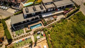 an overhead view of a building with a pool at WOT Ericeira Surf Social in Ericeira