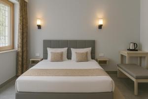 Ένα ή περισσότερα κρεβάτια σε δωμάτιο στο The Aura by Backpackers Stop +16 φωτογραφίες