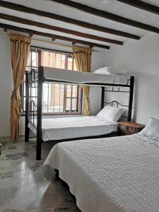 Postel nebo postele na pokoji v ubytování Tikki Lua