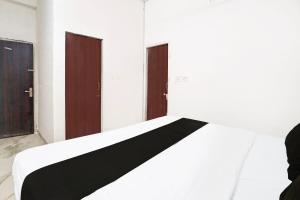 Ένα ή περισσότερα κρεβάτια σε δωμάτιο στο Collection O Ak Hotels