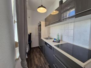 Kuchyň nebo kuchyňský kout v ubytování Mikra Homes24 in Meerane