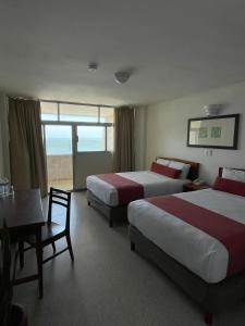 Postel nebo postele na pokoji v ubytování Hotel Royalty