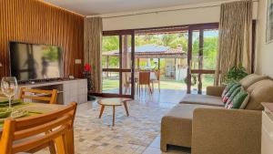 Et tv og/eller underholdning på Aconchegante Casa em Ipioca Jeunne Ville