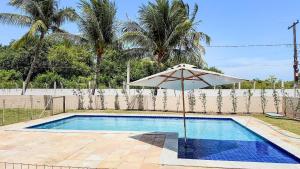 Swimmingpoolen hos eller tæt på Aconchegante Casa em Ipioca Jeunne Ville