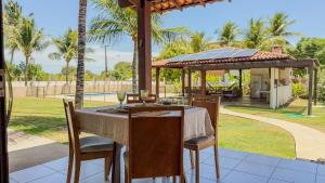 En have udenfor Aconchegante Casa em Ipioca Jeunne Ville