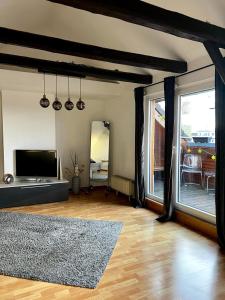 Et tv og/eller underholdning på Terrassenwohnung am Weißen Ross