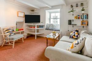 a living room with a couch and a tv at 2 Bed in St. Ives oc-b31979 in St Ives