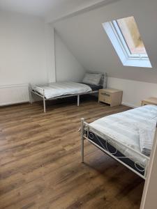 Ένα ή περισσότερα κρεβάτια σε δωμάτιο στο Nature Retreat Ober-Mörlen