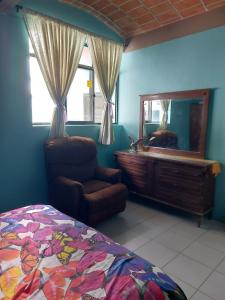 Ένα ή περισσότερα κρεβάτια σε δωμάτιο στο In Oaxaca Casa RodSa