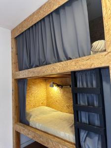 a couple of bunk beds in a room at Travesia Sur Hostel in El Bolsón