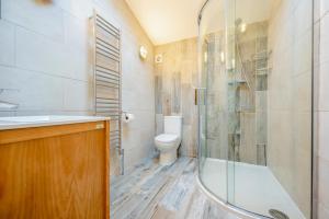 a bathroom with a shower and a toilet at 3 Bed in Polperro oc-h34100 in Polperro +23 photos