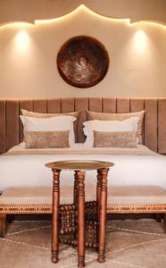 En eller flere senge i et værelse på Luxury Resort Loudi Marrakech