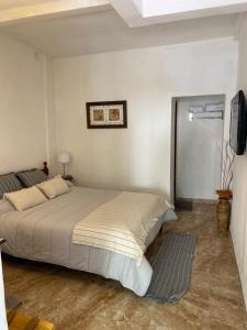 Ένα ή περισσότερα κρεβάτια σε δωμάτιο στο Casita de Norma, Mercedes Corrientes!!!