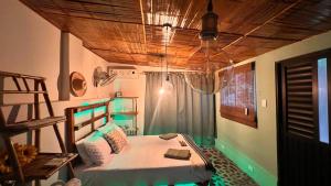 Giường trong phòng chung tại La Magia del Atardecer - Campesina
