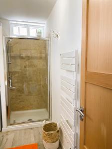 a bathroom with a shower with a glass door at L'insouciance, a cottage in Provence in La Celle-sous-Gouzon +44 photos