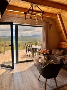 a living room with a couch and a table at Monte zone in Žabljak