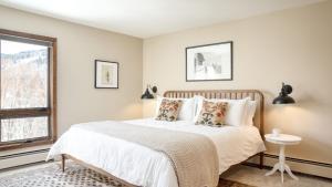 a bedroom with a bed and a window at Cloud 9 by AvantStay Located at the Base of Vail Ski Resort w Community Pool Hot Tub in Vail