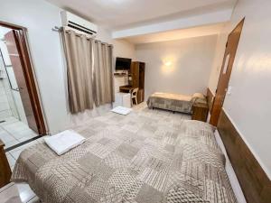 Postel nebo postele na pokoji v ubytování Hotel Maraja