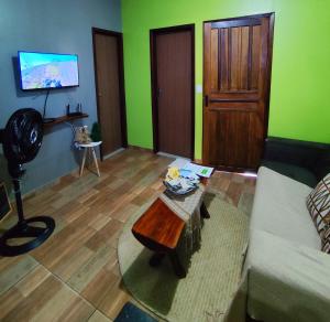 a living room with a couch and a coffee table at Casa Quartzo in Lençóis