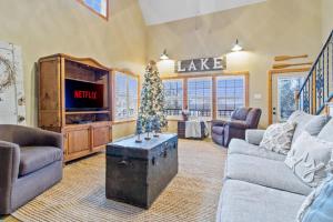 a living room with a christmas tree in the center at Emerald Point, Lakefront with Gorgeous Views in McAlester