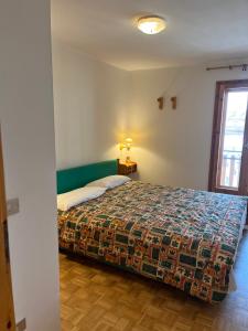 Postel nebo postele na pokoji v ubytování Maison Neve Fiorita