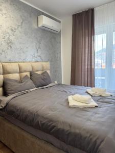 Giường trong phòng chung tại Apartman Obala