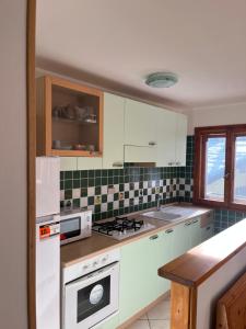 Kuchyň nebo kuchyňský kout v ubytování Maison Neve Fiorita + 6 fotografií