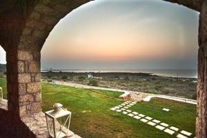 a view of the ocean from a castle window at Element Hotel in Elafonisos