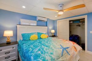 a bedroom with a bed with blue walls at Sand Dollar Suite by Sun Palace Vacations in Fort Myers Beach +33 photos