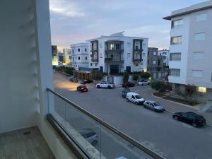 a view of a parking lot with cars parked on the street at Luxe & Sérénité Sahloul 4 in Sousse
