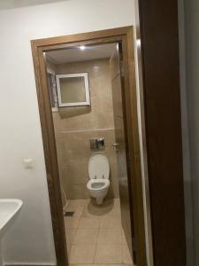 a bathroom with a toilet and a sink at Luxe & Sérénité Sahloul 4 in Sousse +18 photos