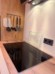 a kitchen with a sink and a counter with utensils at LevelUp 5von5 in Koblenz +14 photos
