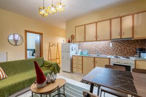 a kitchen with a santa hat on a table at 50 Cube - Mountain Nook Karpenisi in Karpenisi