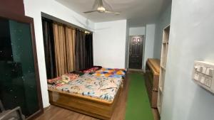 Postel nebo postele na pokoji v ubytování Homestay Devgiri by YatriMap + 13 fotografií