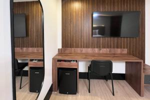 TV a/nebo společenská místnost v ubytování Hotel Continental ByHours