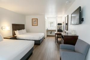 Ένα ή περισσότερα κρεβάτια σε δωμάτιο στο Stargazer Inn and Suites