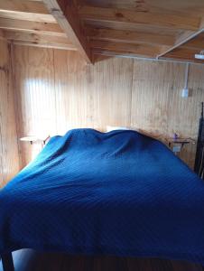 Ένα ή περισσότερα κρεβάτια σε δωμάτιο στο Cabaña Jacinta