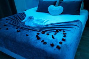 Ένα ή περισσότερα κρεβάτια σε δωμάτιο στο L'Atelier de rêves