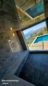 a view from the top of a building with a large window at Casa Amaral in Capitólio