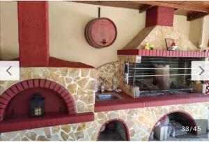 a model of a kitchen with a brick oven at George's family friendly maisonette with great exterior in Drosia +44 photos