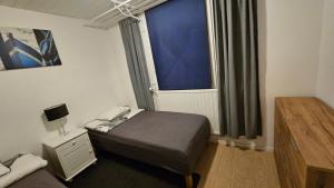 Ένα ή περισσότερα κρεβάτια σε δωμάτιο στο Fiskecamp Rusksele