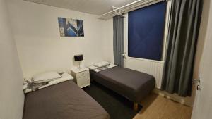 Ένα ή περισσότερα κρεβάτια σε δωμάτιο στο Fiskecamp Rusksele