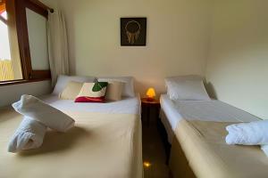 En eller flere senge i et værelse på Villa Piquiá, piscina, área gourmet, jacuzzi + 33 billeder