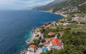 an aerial view of a village on a hill next to the ocean at Cozy Apartment In Dingac With Outdoor Swimming Pool in Gornji Dingač