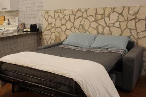 Postel nebo postele na pokoji v ubytování La Piccola Taverna